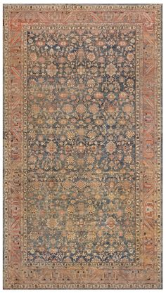 an antique rug with blue and orange colors