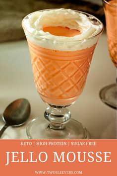 an orange jello mousse in a glass with whipped cream on top and the text keto i low carb high protein jello mousse