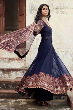 Midnight blue sheer kalidar anarkali with thread work and mirror work embroidery. Paired with cropped blouse, dupatta and pant.
Component: 4
Embroidered
Neckline: U-Neck
Sleeve Length: Full
Fabric: Soft Net, Taffeta Silk; Lining: Cotton, Shantoon
Color: Blue
Thread work and mirror work embroidery
Cutwork anarkali hem and dupatta hem
Closure:
Anarkali: Side zip opening
Blouse: Side zip closure
Pant: Side zip closure - Aza Fashions Kalidar Anarkali, Mirror Work Embroidery, Net Embroidery, Embroidered Anarkali, Blue Sheers, Green Soft, Cropped Blouse, Embroidered Neckline, Blue Soft