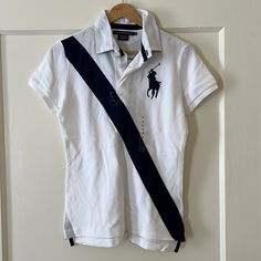 Nwt Ralph Lauren Sport Polo. White With Navy Detailing And A Number On The Back. Never Been Worn. Comes From A Smoke And Pet Free Home. Fitted White Ralph Lauren Top, Ralph Lauren Sport, Lauren White, Ralph Lauren Tops, Color White, Ralph Lauren, Womens Tops, Pet, Navy