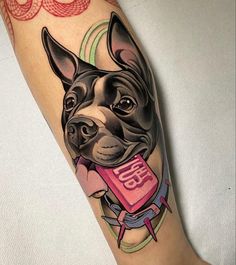 a black and white dog with a book on his leg tattoo design by artist unknown