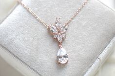 This delicate rose gold crystal drop wedding necklace set is a perfect, feminine finishing touch to any bridal look! A versatile and beautiful addition to your classic, modern, or vintage-inspired wedding.- PLEASE ALLOW APPROX 7 BUSINESS DAYS FOR COMPLETION BEFORE SHIPPING - Created with Premium Cubic Zirconia stones- Necklace measures 16" long and extends to 18 inches.- Matching earrings measure 1-5/8" x 5/8" - Available in rose gold, yellow gold and rhodium (silver) finishes This is an origina Delicate Rose Gold Bridal Necklace, Rose Gold Crystal Bridal Necklace Gift, Rose Gold Crystal Bridal Necklace, Rose Gold Teardrop Bridal Necklace, Elegant Rose Gold Crystal Bridal Necklace, Wedding Necklace Set, Rose Gold Crystal, Vintage Inspired Wedding, Crystal Drop