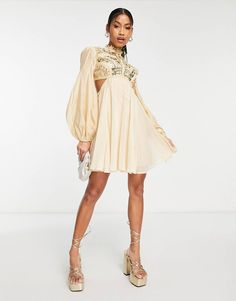 ASOS DESIGN embellished balloon sleeve mini dress with diamante cage cut out detail in beige | ASOS Cream Puff Sleeve Mini Dress For Party, Spring Embellished Beige Mini Dress, Long Sleeve Embellished Beige Dresses, Beige Long Sleeve Embellished Dress, Glamorous Beige Mini Dress With Sequins, Chic Cream Embellished Dress, Chic Embellished Cream Dress, Cream Embellished Long Sleeve Dress, Mini Dress With Sleeves