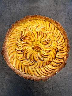 an apple pie is shown on the table