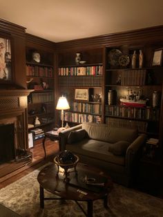 a living room filled with furniture and bookshelves