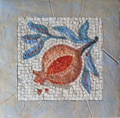 a mosaic tile with a red and blue flower on it