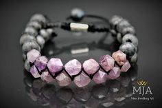 "Women's Size: 6\" - 7.5\" ( 15.2 cm -19.1 cm ) Men's Size:      7\"-8.5\"  ( 17.8 cm - 21.6 cm ) -Made of  8 mm natural-faced amethyst beads, and 8 mm natural larvikite Beads. All finished with black nylon cord, at the ends I used 8 mm larvikite Stone beads.   -Other Designs www.etsy.com/shop/minejewelleryart - The bracelet is adjustable (it could be made in any size). -The products are custom made and done of their kind. They can be differentiated at the minimum level from the photographs (in coloring, patterns, brightness, etc.) -Amethyst  Known as \"the all-purpose stone\", Amethyst is a protective stone that helps to relieve stress and anxiety in your life, and the symptoms that accompany it, namely headaches, fatigues, and anxiety. It also aids in cell regeneration (supporting your b Larvikite Bracelet, Coloring Patterns, Amethyst Crystal Bracelet, Bracelet Macrame, Shamballa Bracelets, Cell Regeneration, Raw Amethyst, Natural Gemstone Jewelry, Crystal Beads Bracelet