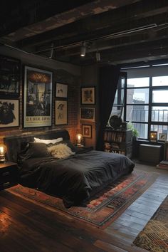 a bed sitting in a bedroom on top of a wooden floor next to a window