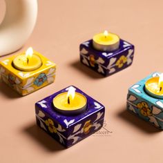 three small candles sitting on top of a table