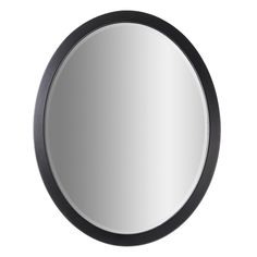 a round mirror on a white wall with black trimmings and an oval frame