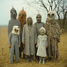 a group of people in costumes standing next to each other