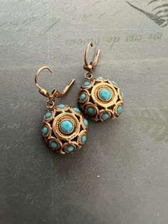 "This beautiful set of earrings  are for pierced ears. Note, the earrings are not signed Popesco, but the earrings from this designer usually aren't signed. The earrings are beautifully detailed and feature a turquoise colored center bead surrounded by smaller beads. The earrings have a hollow back so are very light weight and comfortable to wear.  Catherine Popesco is a Paris native and leading force behind the revival of the Art Nouveau and Art Deco eras in France. Popesco discovered a treasure trove of old stamping while wondering old factories in Paris. With her creativity, Catherine used the stamps to create new collections. Her pieces are manufactured in the heart of the Loire Valley in France.  The La Vie Parisienne are made of old silver, a unique French process of laying sterling Turquoise Costume Jewelry Earrings For Gift, Turquoise Pierced Earrings For Formal Events, Turquoise Pierced Earrings For Formal Occasions, Formal Turquoise Pierced Earrings, Vintage Turquoise Round Earrings, Turquoise Clip-on Round Earrings, Old Factory, Loire Valley, Earrings Elegant