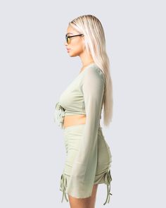 This olive mesh top will complete any fit in a subtle, but undeniably sexy way 💚 With a flattering V-neck and waist tie design - this long-sleeved cropped top is all you need to exude a flirty, and confident vibe 😌 Green Long Sleeve Crop Top For Night Out, Ruched Long Sleeve Crop Top For Party, Spring Crop Top With Sheer Sleeves, Long Sleeve Ruched Crop Top For Party, Summer Crop Top With Sheer Sleeves, Long Sleeve Ruched Crop Top For Summer, Chic Sheer Long Sleeve Crop Top, Sheer Long Sleeve Crop Top For Spring, Flirty Stretch Long Sleeve Crop Top