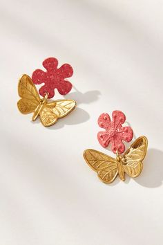 Golden butterflies flutter beneath delicate blooms in pale, springtime hues. Brass with hand painted finish and gold-plated lever backs. Nickel and lead free. 1” [2.5 cm] long. Spring Gold Jewelry With Butterfly Charm, Whimsical Gold Jewelry For Spring, Spring Whimsical Gold Jewelry, Whimsical Spring Gold Jewelry, Pink Butterfly Earrings For Summer, Hand Painted Jewelry For Spring, Spring Hand Painted Jewelry, Drop Chandelier, Fashion Butterfly