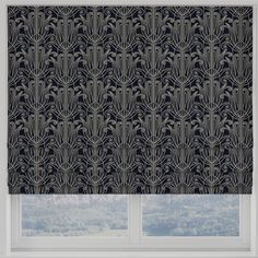 a black and white patterned roman blind in front of a window