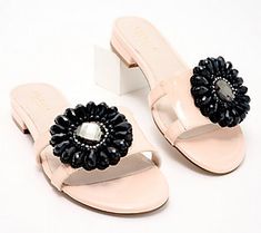 A comfortable flat that's fancy enough for formal events, these flower embellished leather sandals are the season's most flirty and fashionable look. A slide-in design with a low heel means you won't miss a moment at your next social gathering. From Cecelia New York. Elegant Beach Flats For Spring, Elegant Spring Beach Flats, Summer Party Flats With Low Heel, Elegant Leather Flats For Summer, Elegant Low Heel Summer Flats, Elegant Vacation Flats, Leather Embellished Low Heel Sandals, Embellished Low Heel Sandals For Summer, Summer Embellished Low Heel Sandals