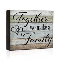 a wooden sign that says together we make a family