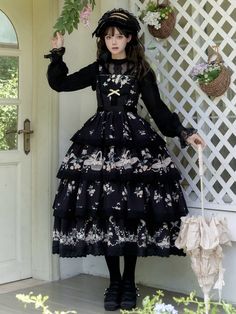 This enchanting piece features a delicate daisy and flower basket print, adding a touch of whimsical charm. The smocked back ensures a comfortable and flattering fit, while the tiered skirt design provides a graceful silhouette. Perfect for tea parties, garden strolls, or any occasion that calls for classic Lolita sophistication.   	 		 			Size 			S 			M 			L 		 		 			Full Length 			117-120 			120-123 			123-126 		 		 			Bust 			78-90 			83-95 			88-100 		 		 			Waist 			62-74 			67-79 			72-84 Cottagecore Tiered Dress For Garden Party, Tiered Cottagecore Dress For Garden Party, Tiered Lace Patchwork Dress For Garden Party, Cottagecore Tiered Skirt Dress For Garden Party, Vintage Tiered Skirt Dress For Spring, Cute Black Floral Print Dress, Cute Black Dress With Floral Print, Cottagecore Dresses With Ruffles And Tiered Skirt, Cottagecore Tiered Dress With Ruffles