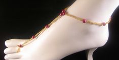 Gold Beaded Barefoot Sandal, Red Pearl Barefoot Sandal, Beach Sandal Gold Seed Beaded, Wedding Sandal Gold, Delicate Gold Barefoot Sandal Made with Gold colored Seed beads and Raspberry red pearls and stretch cord and slips over ankle and goes down foot and has one inch opening for the toe. SOLD AS ONE / SINGLE. If you would like to purchase a pair, check to see if there is another one listed. If another is not available, please feel free to send me a message, and I will do my best to accommodate you :) Will fix if adjustments are needed and any questions can be asked. The nature of the materials makes the fit easy and one size fits most. Send me a note with any questions or concerns as well as custom order requests for larger orders such as bridal parties. Other Beach Sandal listings: htt Adjustable Open Toe Gold Barefoot Sandals, Handmade Gold Barefoot Sandals For Summer, Adjustable Gold Ankle Wrap Barefoot Sandals, Gold Beaded Barefoot Sandals For Summer, Beaded Gold Barefoot Sandals For Beach, Pearl Barefoot Sandals, Wedding Sandals, Beach Sandals, Anklet Jewelry