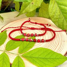 Elevate your boho style with our Red Beaded Thread Macrame Bracelet  and Anklet Set. This stunning set features intricately handwoven macrame designs adorned with delicate red stone beads for a touch of elegance. The adjustable bracelet and anklet ensure the perfect fit for any wrist or ankle size. Made with love and attention to detail, our handmade jewelry adds a unique and artisanal touch to any outfit. This versatile set is perfect for any woman looking to add a touch of bohemian flair to he Bohemian Red Hand-strung Braided Bracelets, Red Bohemian Macrame Jewelry, Adjustable Red Bohemian Jewelry, Bohemian Adjustable Red Jewelry, Adjustable Bohemian Red Jewelry, Red Macrame Friendship Bracelets For Beach, Red Macrame Bracelet For The Beach, Red Macrame Bracelets For Beach, Red Macrame Jewelry For Beach