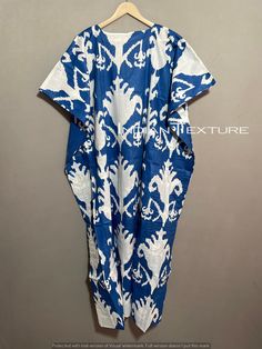 "This Beautiful Indian Cotton Caftan Or Can Be Called As Tunic Is Made With Super Fine Quality Cotton And Designs Have Been Crafted By Hand Prints. Measurements :- Size - Free Size Length -138 Cm / 54 Inches Bust/Chest Size - 87 CM/ 34 Inches Fabric - 100% Cotton Pattern - Floral Kaftan Has Adjustable Drawstring Waist To Loose Or Tight , Kaftan Has V Shape Neck Which Is 8\" Inches Deep. Kaftan Is Multi-Purpose And Can Be Worn As A Cover Up At The Beach ,Lounge Wear ,Sleepwear ,Pregnant Women Hos Traditional Patterned Maxi Dress For Beach, Bohemian Blue Sleepwear For Vacation, Blue Bohemian Sleepwear For Vacation, Blue Ikat Print Kaftan For Summer, Blue Summer Kimono For Home, Summer Blue Kimono For Home, Summer Blue Ikat Print Kaftan, Traditional Summer Vacation Thobe, Patterned Short Sleeve Kaftan For Beach