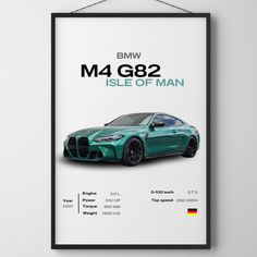 a poster hanging on the wall above a green sports car