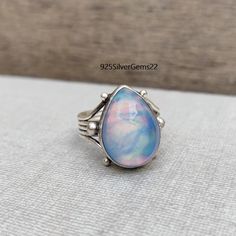 Welcome to our shop 925SilverGems22 Description:-   Style:- Band Advantages of Aurora Opal Ring :- Aurora Opal Metaphysical Properties It is supposed to boost intuition, inspire creativity, and encourage emotional equilibrium. Others believe it has the power to magnify good vibes and drive away bad ones   Occasion:- Anniversary Gift, Birthday Gift, Wedding Gift, Gift Pendant, Valentine's Gift, Engagement Gift, New Year Gift, Christmas Gift, Other Occasion, etc. Your order will be handmade and re Sterling Silver Teardrop Opal Ring, Teardrop Opal Ring In Sterling Silver, Elegant Teardrop Opal Ring In Sterling Silver, Silver Teardrop Opal Ring In Sterling Silver, Sterling Silver Teardrop Rings Stamped 925, Silver Opal Ring As Gift, Silver Opal Ring For Gift, Silver Opal Ring Perfect As A Gift, Gift Opal Ring Stamped 925