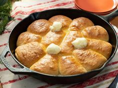 a pan filled with bread on top of a table