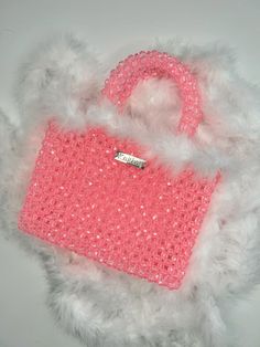 MODEL KNITKOS BAG- FLUFFY . Holds an iPhone smartphone, keys, headphones (and many small trinkets) . . #knitkos_bag . ▫️Material: Acrylic bead, fluff ▫️Size: 23 (with handles)/18sm/6sm ▫️The set includes a cast chain of 1 m ▫️Delivery anywhere in the world ▫️The price is $250 USD ▫️Repeat possible in any color . . . @beaded.bags @elleusa @elle @voguekorea @vogueitalia @vogue @voguemagazine @cosmopolitan #сумкаизбусин #жемчужнаясумка #сумкаизбисера #сумкаручнойработы #сумкакупить Pink Beaded Tote Bag, Pink Beaded Shoulder Bag, Pink Embellished Handheld Shoulder Bag, Pink Embellished Rectangular Evening Bag, Pink Embellished Shoulder Bag For Party, Pink Party Bag With Pearl Handle, Luxury Pink Bag With Pearl Handle, Pink Rectangular Shoulder Bag With Pearl Handle, Pink Beaded Party Shoulder Bag