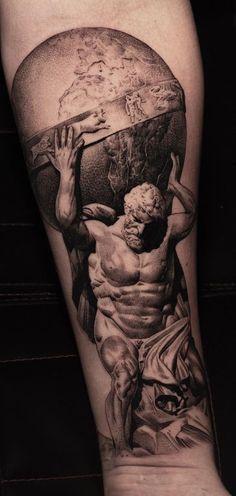 a man with a large piece of artwork on his leg is shown in black and white