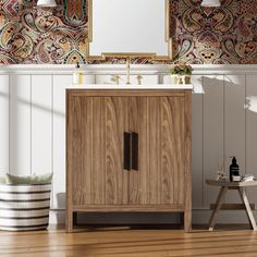 a bathroom vanity with a mirror above it next to a stool and wallpapered walls