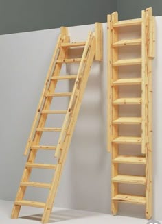 two wooden ladders are next to each other