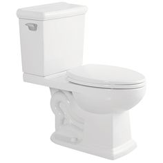 a white toilet sitting next to a trash can on top of a white countertop