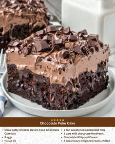 a chocolate poke cake on a plate with a fork and milk bottle in the background