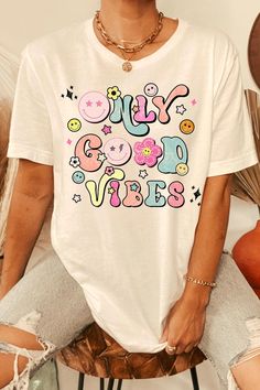 Trendy Multicolor T-shirt With Text Print, Spring Fun Graphic T-shirt, Funny White T-shirt With Letter Print, Retro White T-shirt With Funny Print, Colorful Casual T-shirt With Letter Print, Fun Multicolor Printed T-shirt, Spring Multicolor T-shirt With Text Print, Groovy Short Sleeve T-shirt With Funny Print, Multicolor Letter Print T-shirt For Streetwear