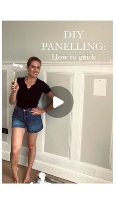 a woman standing in front of a wall with the words diy paneling how to guide