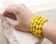 "I'm loving this sunny yellow color. I simply strung four strands of beautiful yellow howlite stones together to create this bold bracelet. The bracelet has a silver lead free tierra cast large toggle closure for easy on and off. Choose from 7\", 7.5\" or 8\" if you require another size please, leave me the request in the \"notes to seller\" box upon checkout. I strung this bracelet on a 49 strand flexible nylon coated stainless steel wire for added durability and flexibility. See the matching N Handmade Yellow Stretch Bracelet, Yellow Stretch Bracelet As A Gift, Semi Precious Stone Bracelet, Bridesmaids Jewelry, Yellow Bridesmaids, Yellow Jewelry, Howlite Stone, Yellow Turquoise, Multi Strand Bracelet