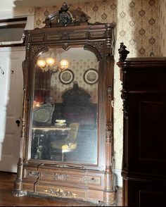 a large mirror sitting on top of a wooden dresser