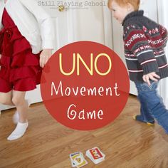 two young children playing with an uno movement game