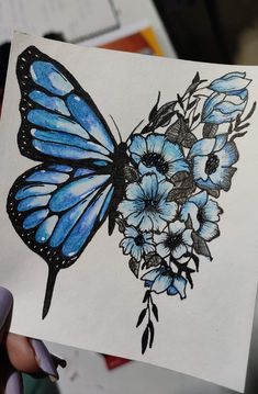 a drawing of a butterfly with blue flowers