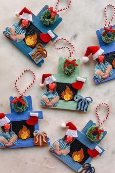 four christmas ornaments are sitting on a table