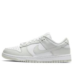 The women's Nike Dunk Low Photon Dust, model DD1503-103, is a stylish sneaker that combines white leather with Photon Dust leather overlays and Swooshes. The design features a woven Nike label on the tongue and embroidered Nike branding. Whether you’re a sneaker enthusiast or simply looking for a comfortable and fashionable option, the Nike Dunk Low Photon Dust is a great choice! (SNKR/Skate/Light/Low Top/Women's/Non-Slip) Grey Nike Dunks, Cheap Shoes For School, Shoes Under 100 Dollars Nike, Women Low Dunks, Low Rise Dunks, Nike Dunks With Dress, Womens Nike Dunks Low, Women’s Nike Dunks, Aesthetic Nike Shoes