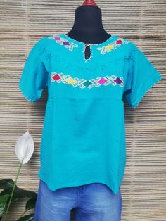 "Hand-embroidered blouse, blouse with pincers and frets, Mexican blouse, comfortable blouse, blouse in fresh blanket, ethnic blouse. This blouse in one size and fits M/L We ship anywhere in the word, from Tepic, Nayarit, mx. Made by artisans from Oaxaca, Mx. Inch measure: WIDTH: from armpit to armpit: 22\" LONG: 25\" We recommend washing by hand with cold water, tender in the shade, to better preserve the original color." Bohemian Tops With Traditional Patterns For Summer, Folk Style Blouse With Woven Motifs For Festivals, Festival Blouse With Woven Motifs, Handmade Bohemian Cotton Blouse, Folk Style Festival Tops With Woven Motifs, Folk Style Cotton Top With Traditional Patterns, Traditional Beach Tops With Embroidered Border, Traditional Embroidered Top For Beach With Geometric Design, Traditional Beach Top With Geometric Embroidery