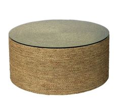 a round glass and jute coffee table on an isolated white background with no people around it