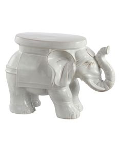 an elephant shaped white ceramic container with lid