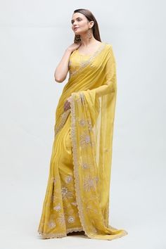 Yellow saree featuring floral gota hand work highlighted with moti and dabka work. Paired with a co-ordinating blouse. - Aza Fashions Reception Tissue Silk Saree With Gota Work, Semi-stitched Saree With Gota Work For Reception, Unstitched Saree With Gota Work For Reception, Saree With Gota Work For Diwali Reception, Gota Work Saree For Reception And Diwali, Diwali Saree With Gota Work For Reception, Diwali Reception Saree With Gota Work, Yellow Unstitched Saree With Gota Work, Fitted Yellow Saree With Gota Work