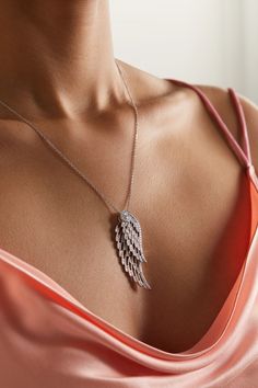 Garrard's necklace is designed to mimic the natural shape and delicacy of angel wings - each pendant is intricately crafted to move independently from another as they overlap. Cast from 18-karat white gold in an openwork design that brings "an ethereal lightness", they're illuminated with round-cut diamonds to accentuate their swooping curves and strung on an adjustable chain. Luxury Flower-shaped Diamond Necklace In Fine Jewelry Style, Elegant Silver Wing-shaped Jewelry, Elegant Silver Wing-shaped Necklace, Elegant Wing-shaped Silver Jewelry, Elegant Wing-shaped Yellow Gold Necklace, Elegant Yellow Gold Wing-shaped Necklace, Elegant Wing-shaped White Gold Necklace, Elegant White Gold Wing-shaped Necklace, Elegant Gold Winged Jewelry