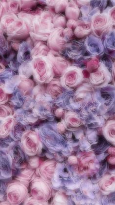 pink and purple flowers are mixed together in this image with blurry effect to make it look like they have been made out of yarn