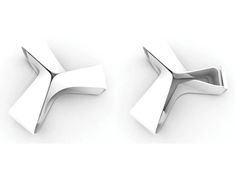 two pieces of metal that are shaped to look like an x and k, on a white background