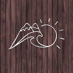 a wooden background with mountains and waves drawn on the wood grained surface in white